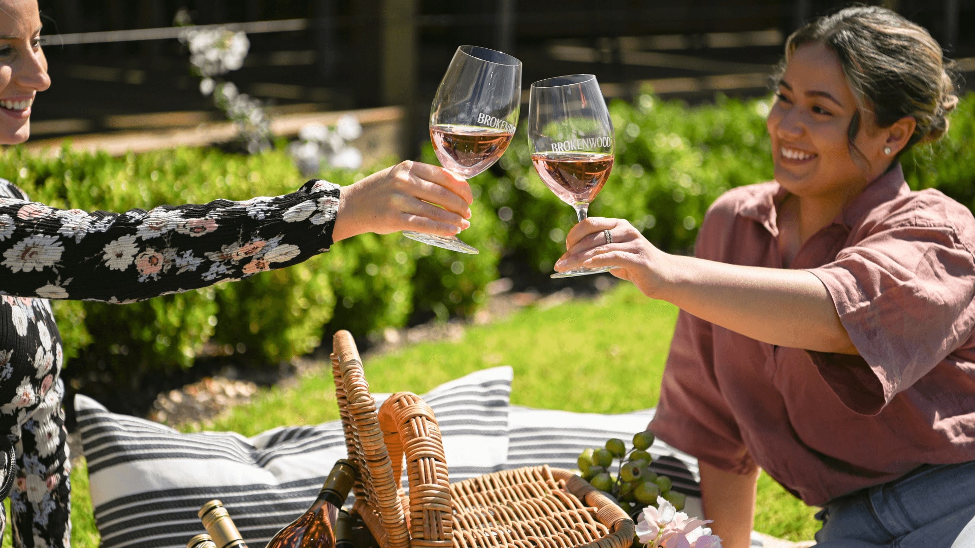 women-clinking-brokenwood-wine-glasses