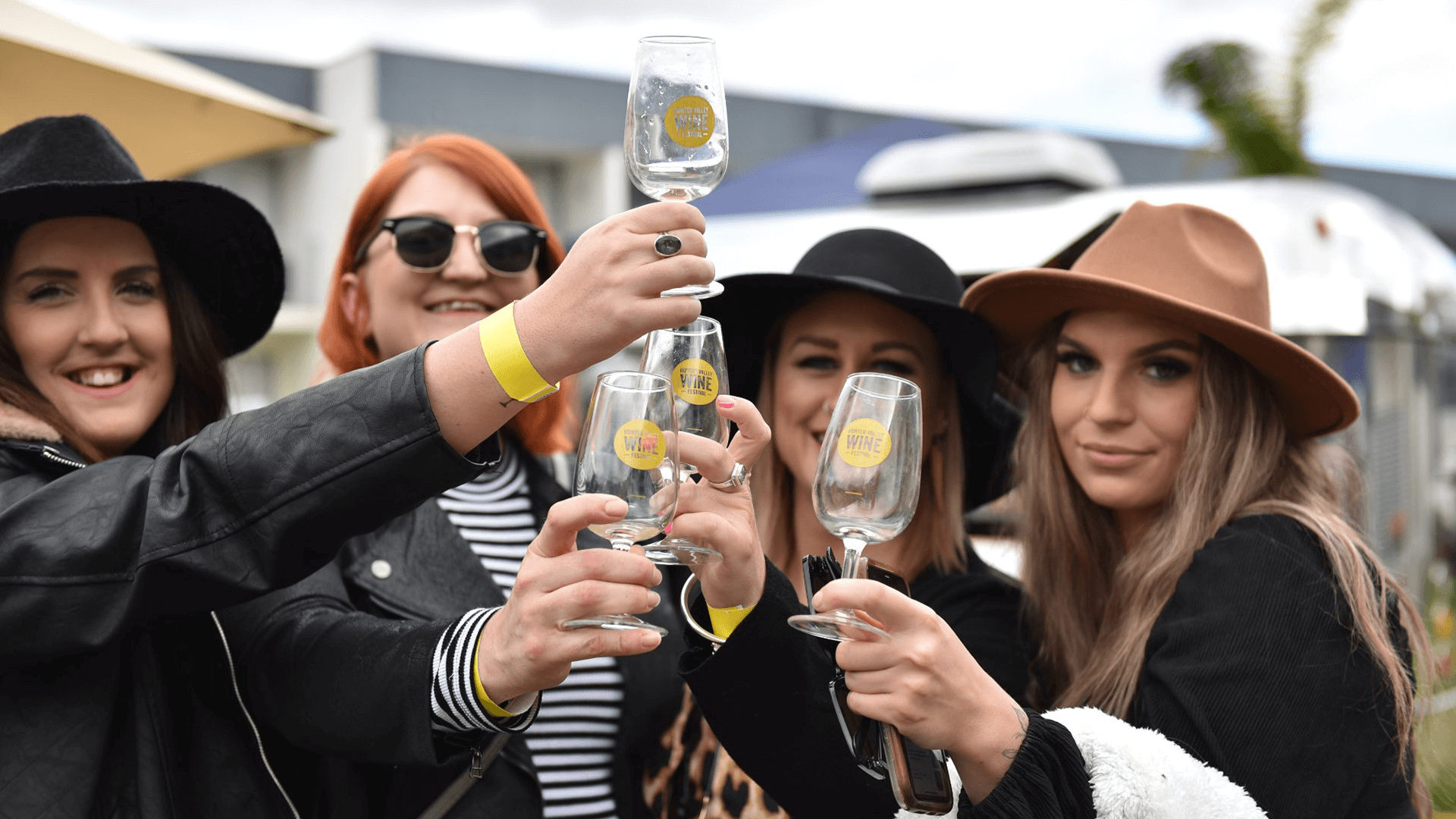 Friends raising glasses at Hunter Valley Wine and Beer Festival