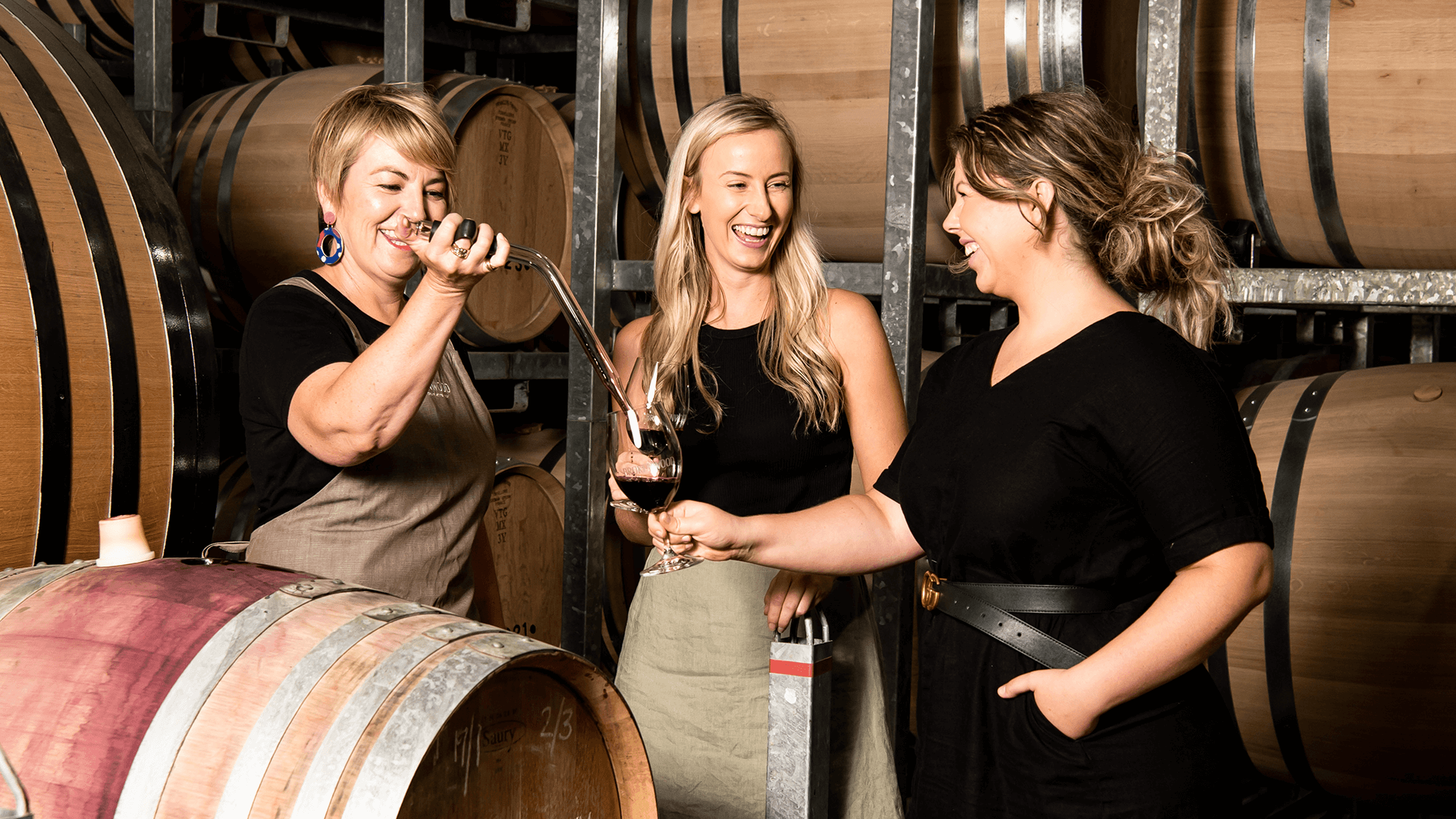 wine-pouring-for-guests-in-cellar-room