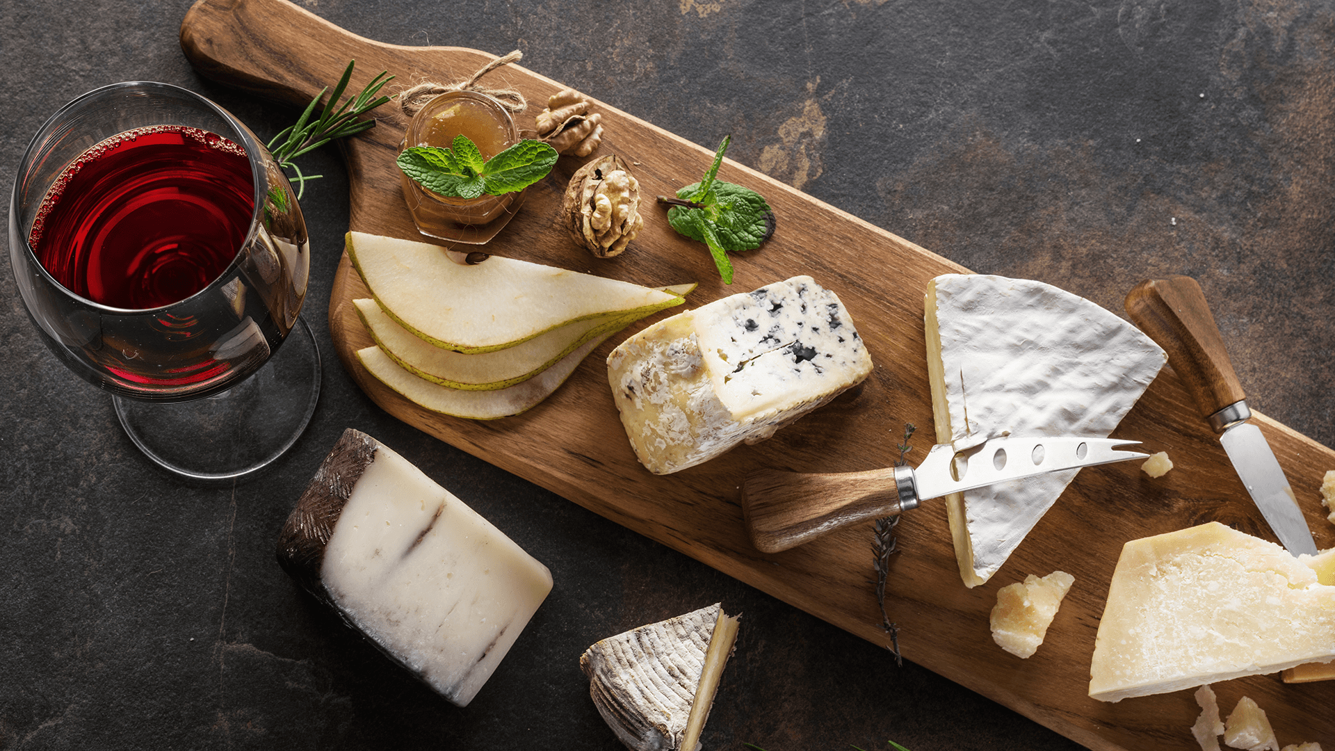aged-cheese-board-with-glass-of-red-wine