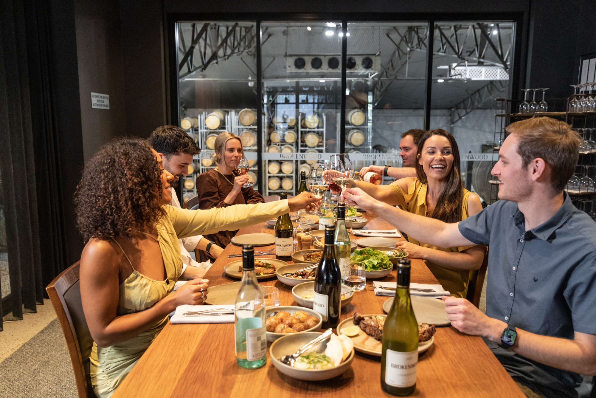 people gathered at a table in Brokenwood