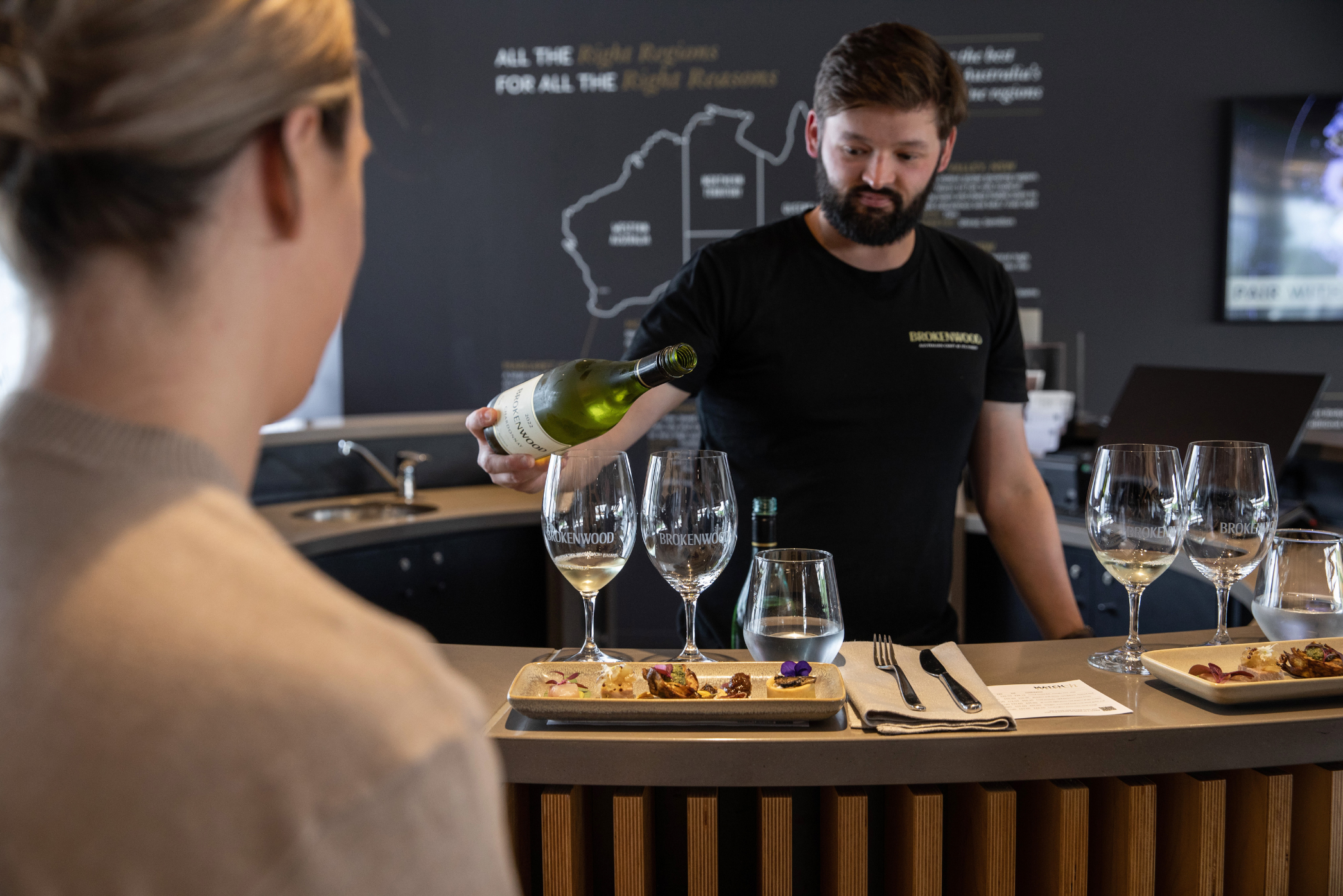 wine being served to two people at Brokenwood